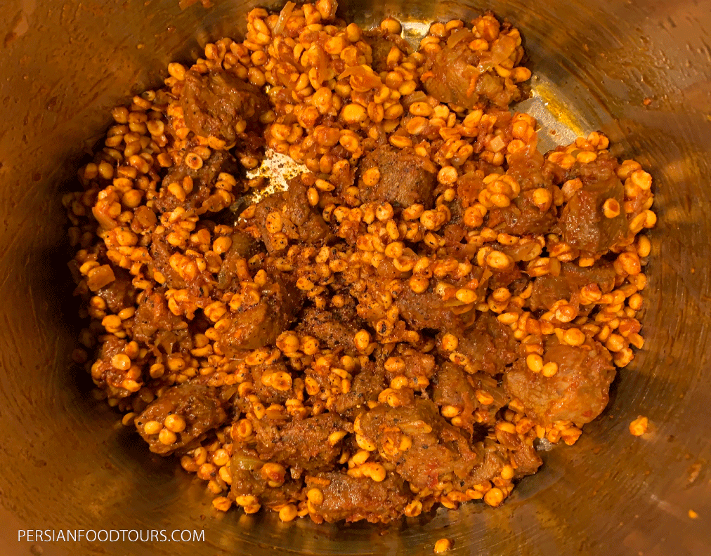 Khoresht Gheymeh Bademjan-meat mixed with fried onions, split peas and tomato paste